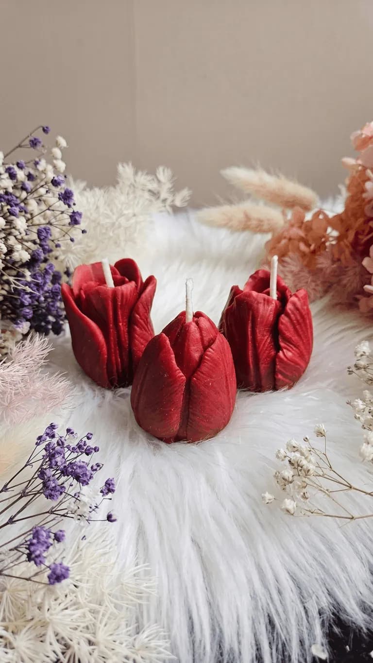 Three sculptural red tulip candles