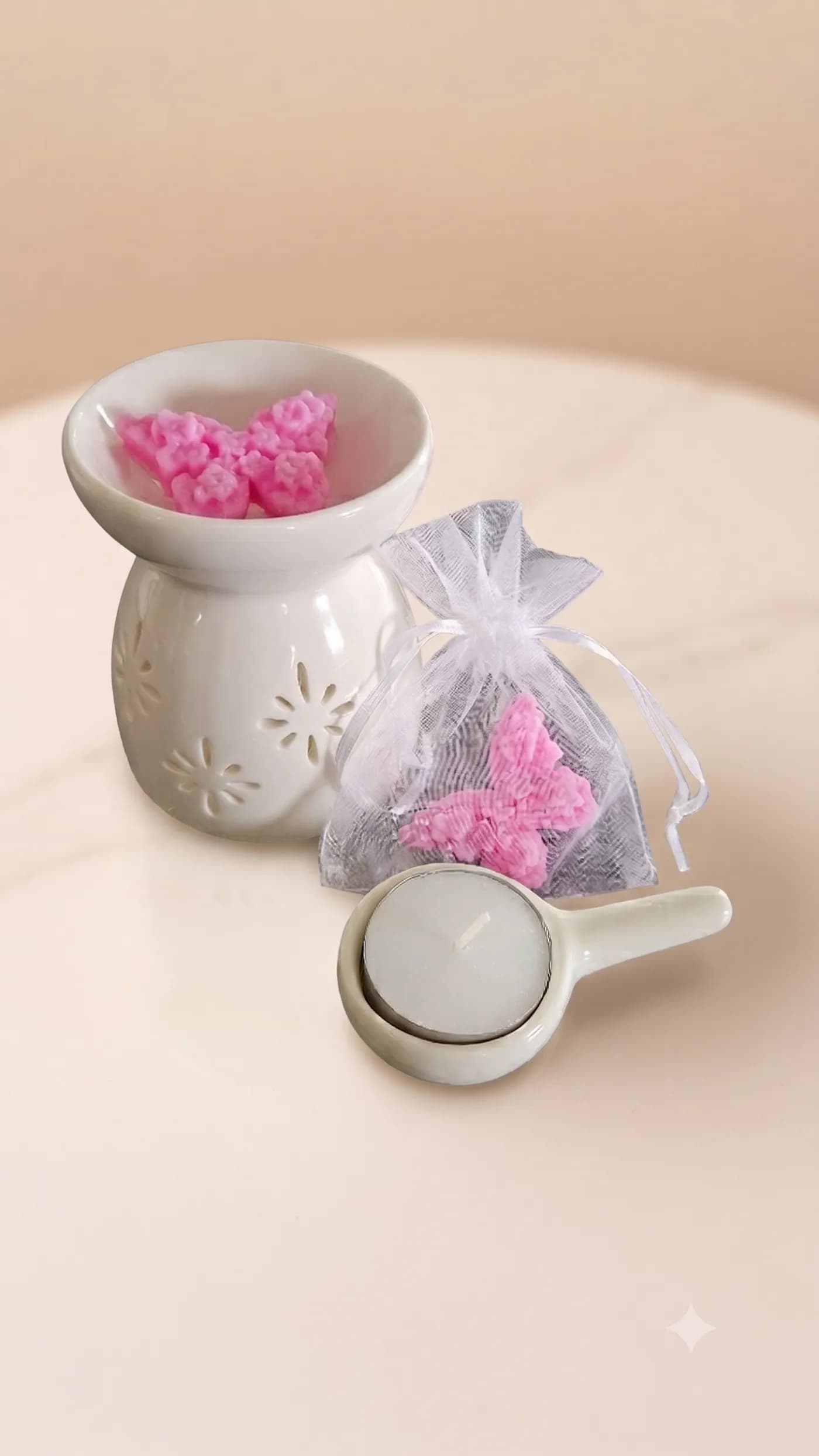 Pink wax melts with a white ceramic burner and gift bag