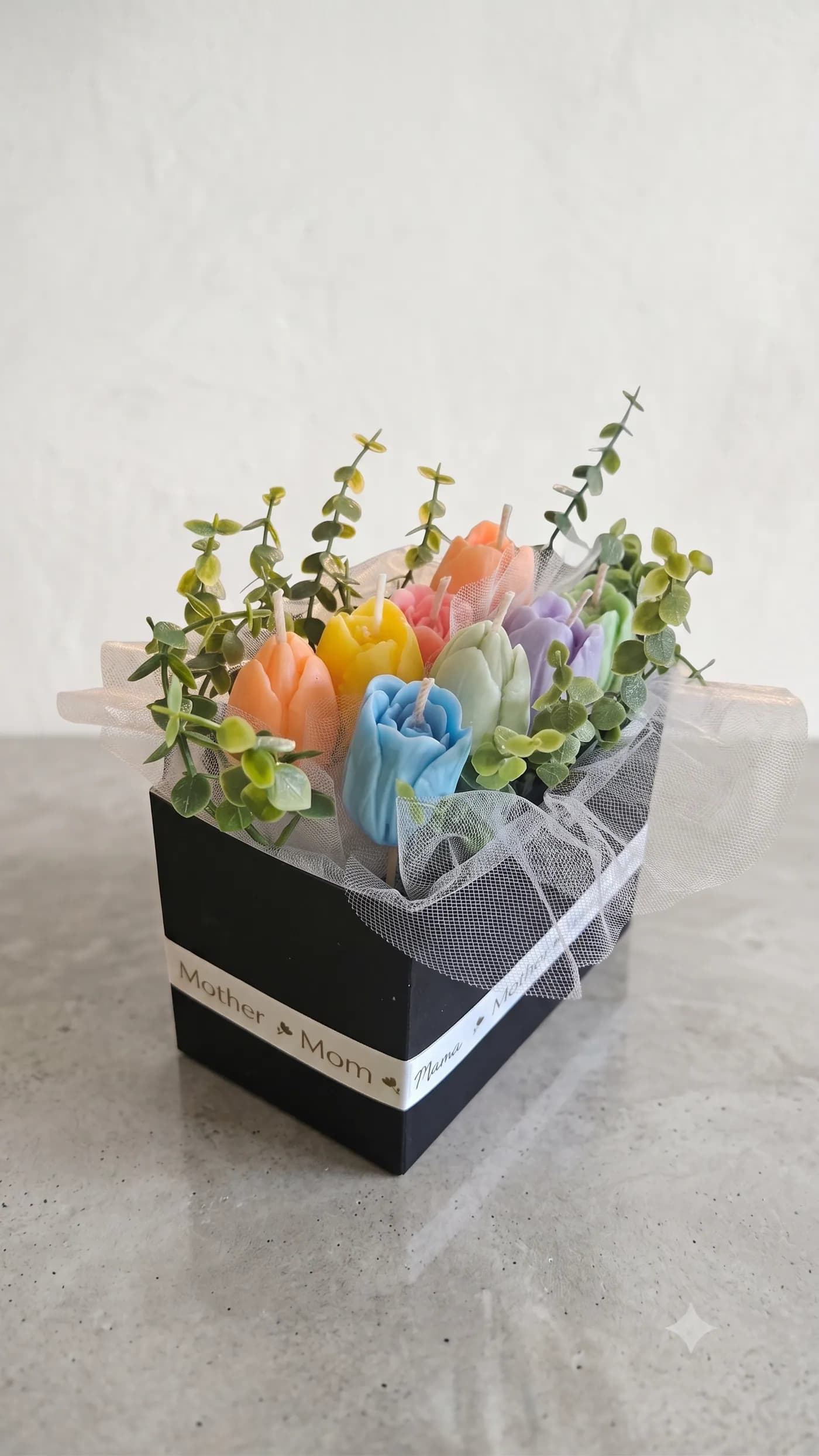 Pastel floral candle bouquet in a black keepsake box
