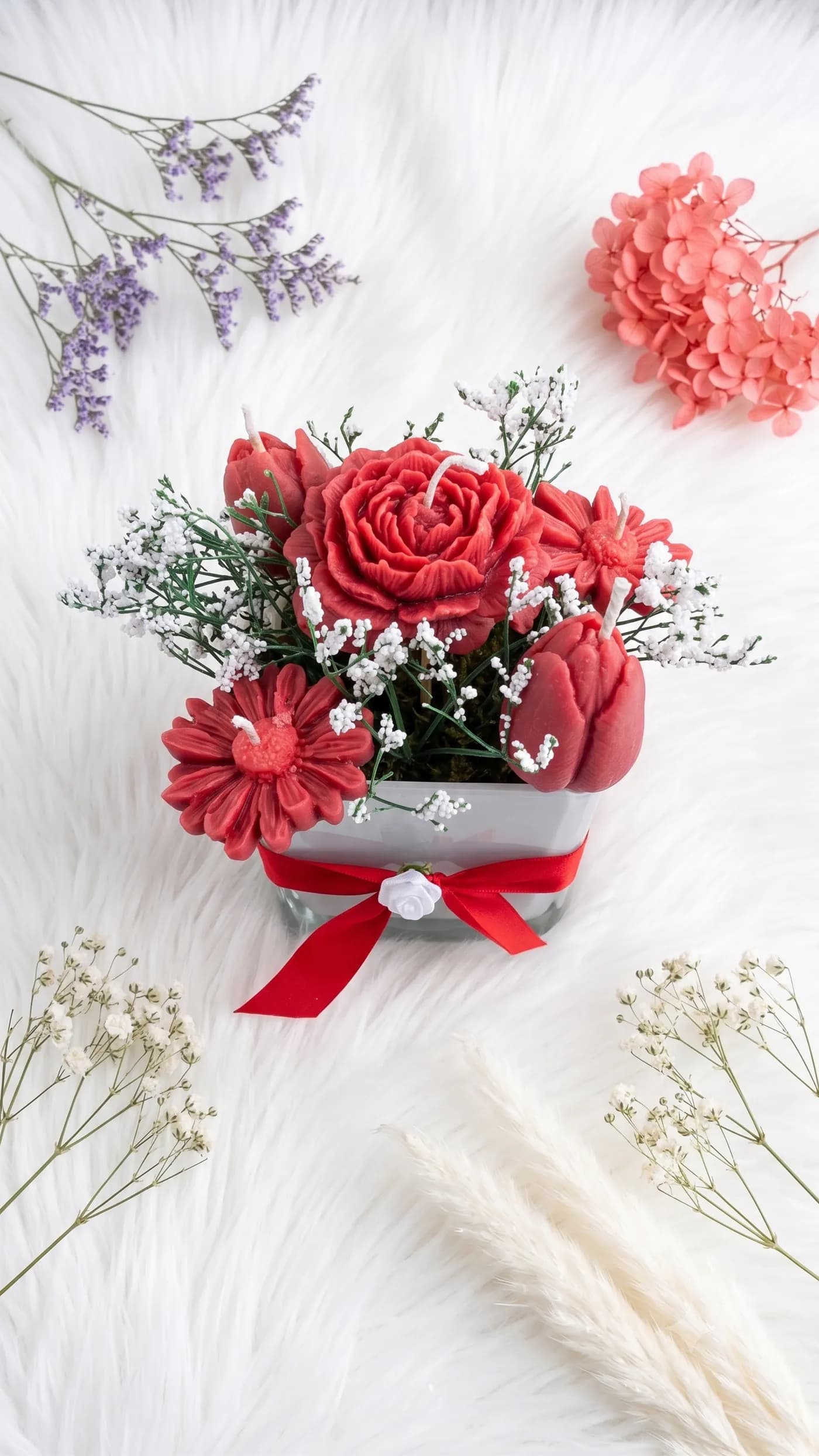 Red rose candle bouquet tied with a satin ribbon