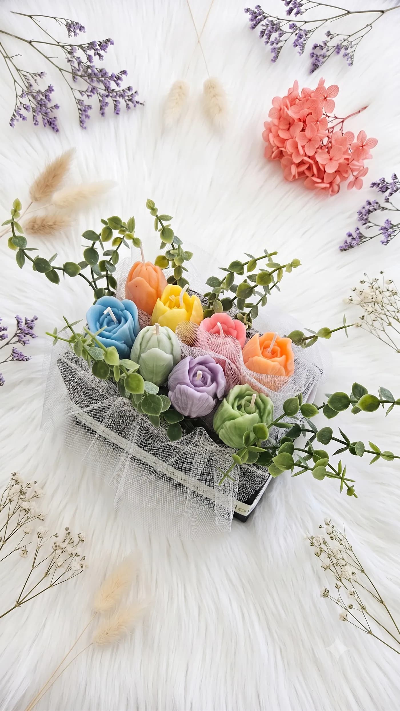 Pastel rose candle garden in a white wooden keepsake