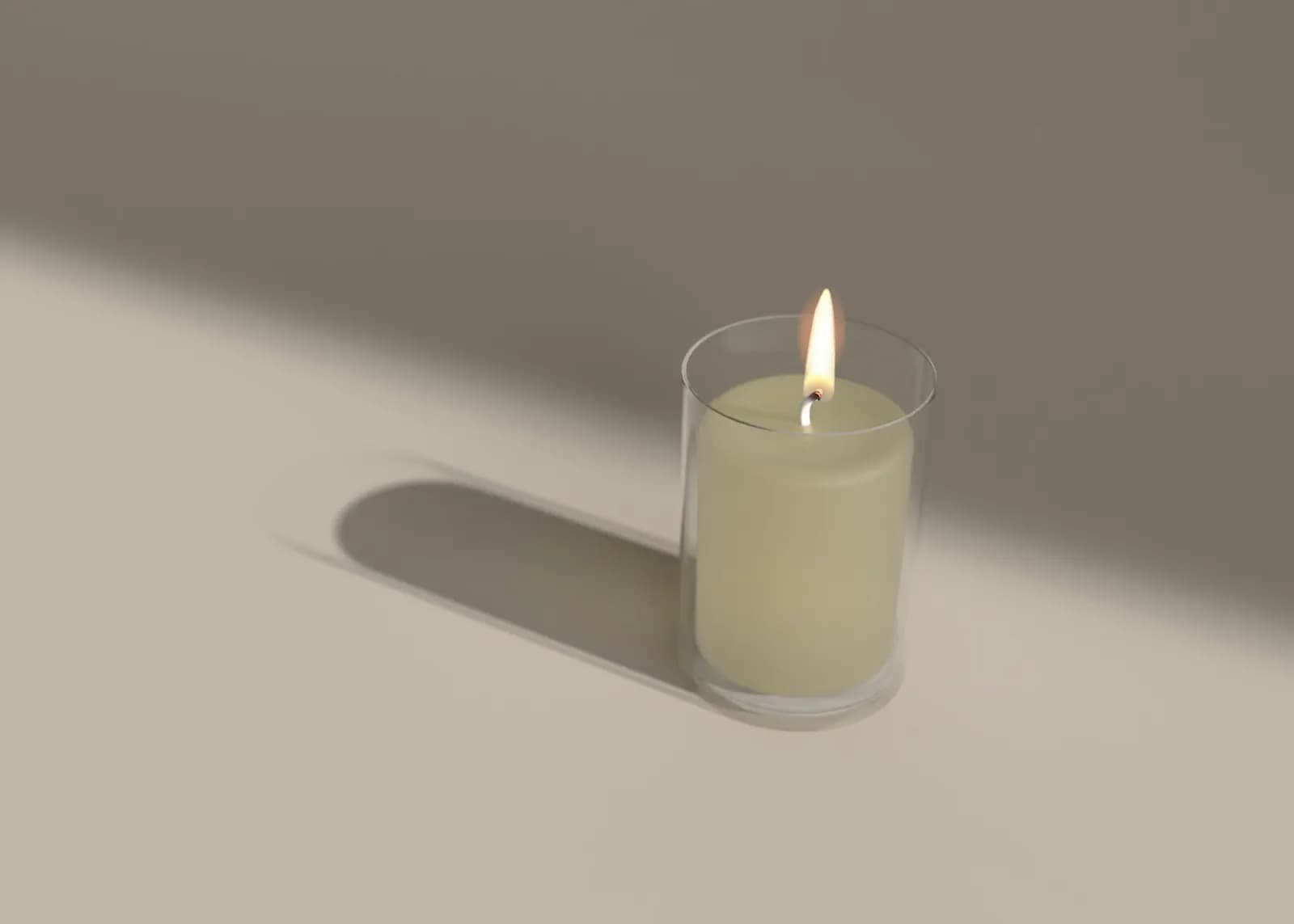Minimal glass candle casting a long shadow in soft light